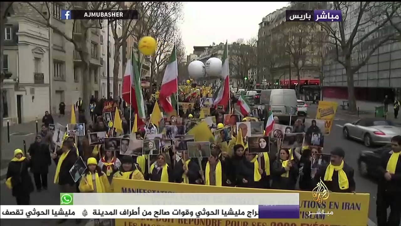 شاهد المعارضة الإيرانية تنظم مظاهرة في باريس احتجاجا على زيارة الرئيس الإيراني