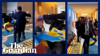 Russian man snatches Ukrainian flag and triggers scuffle at Black Sea conference