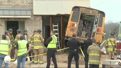 School bus driver cited after crashing into building
