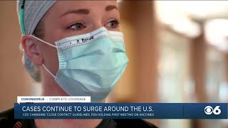 COVID-19 cases surge across US; CDC revises 'close contact' guidelines