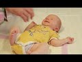 Super cute tenday old baby boy spencernewborns legs still in foetal positionfroggy legs