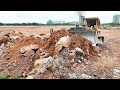 Massive expertise operator with power bulldozer komatsu d58e pushing clearing stone big landfill