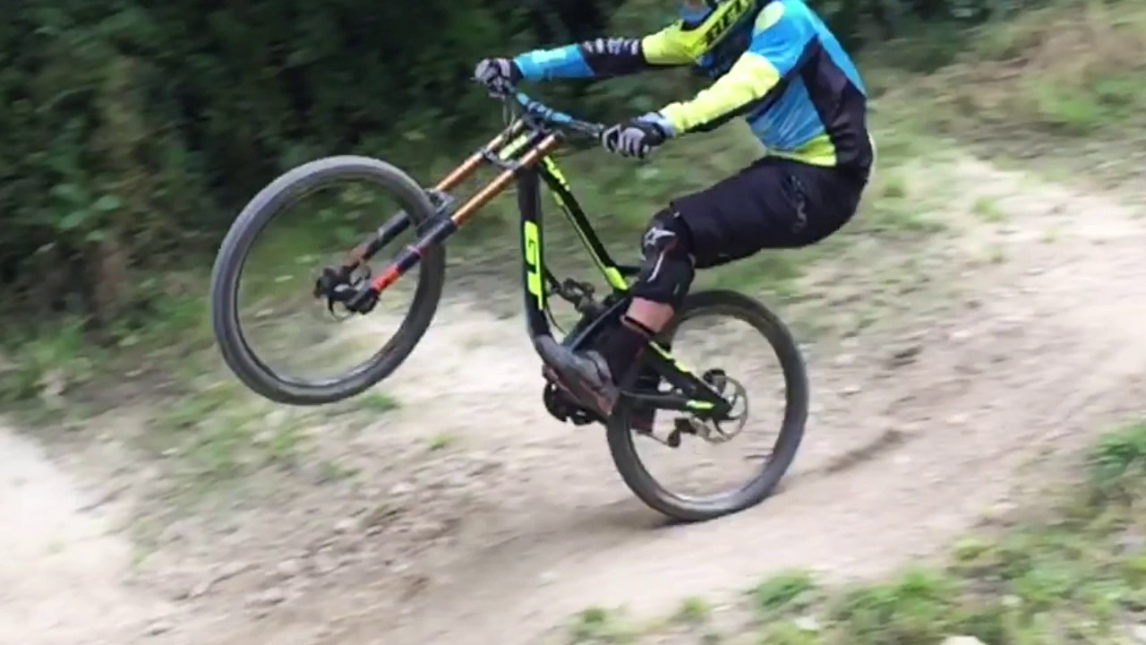 road fighter Guy Does Wheelies Going down Steep Road