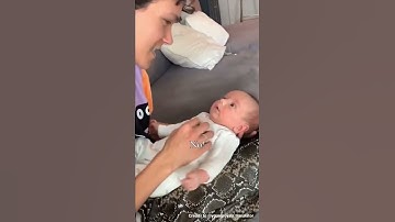 Omar Rudberg singing to a baby