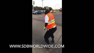 CROSSING GUARD TURNS UP IN THE MIDDLE OF THE STREET
