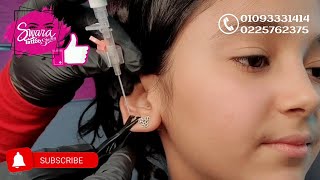 تركيب بيرسينج لبنوته صغنونه كانت خايفه ف الاول وبعد كدة ضحكت 🤩 | Swara Tattoo Studio