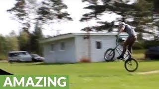 Dude pulls off insane backwards bike flip