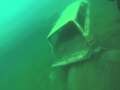 sunken vehicles at rock quarry