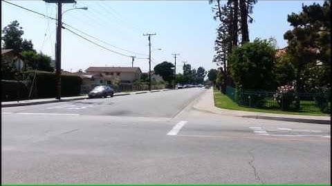 2 Police crown vic making a fast response code 3