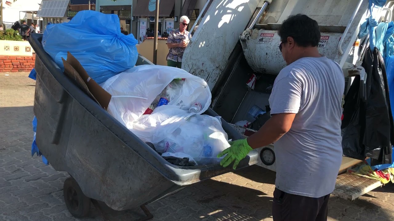 Mini Isuzu rear loader on Catalina beach trash