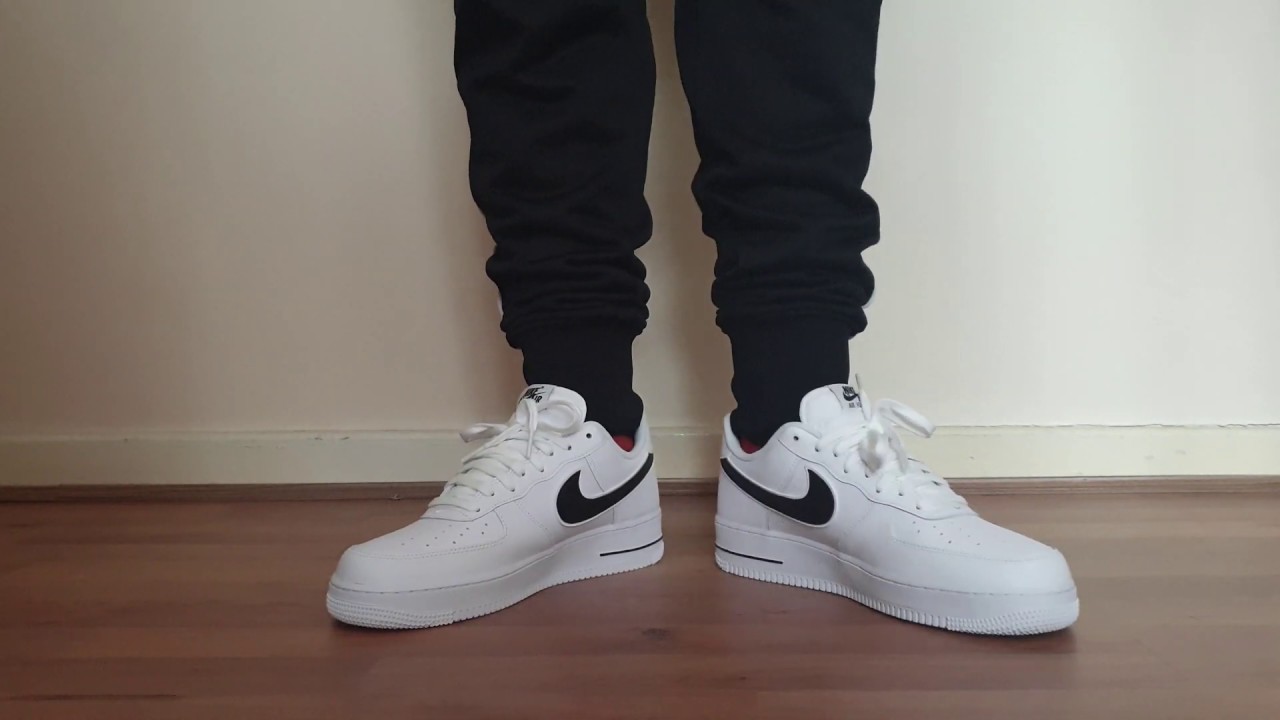 white and black air force 1 on feet