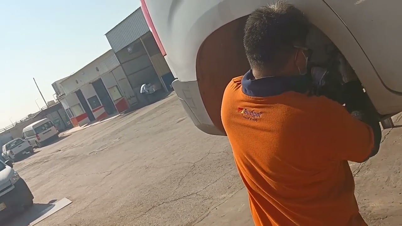 The car's brakes are broken, and a mechanic is fixing it quickly. Just look| wander with farooq