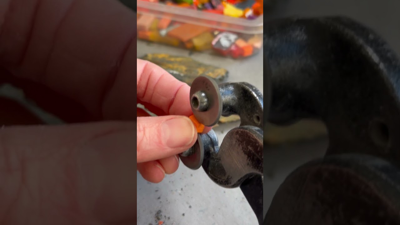 Cutting up smalti (glass) with wheeled nippers, ready to make a mosaic 