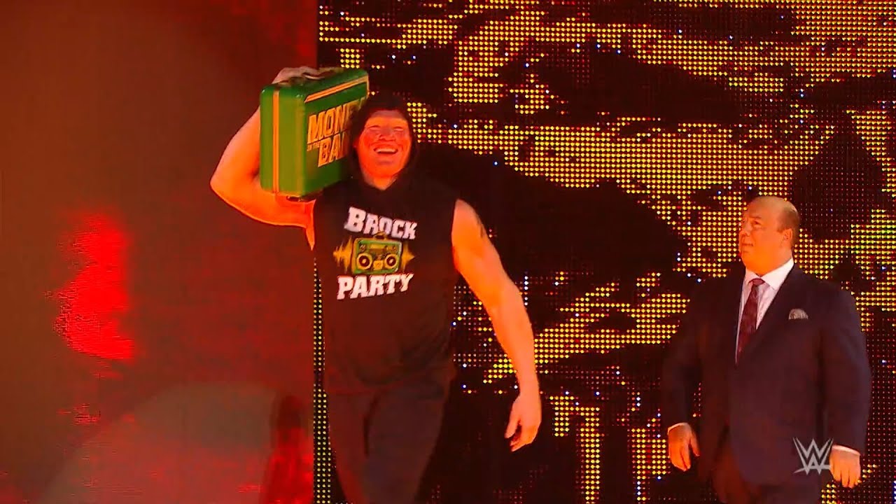 Brock Lesnar celebrates his Money in the Bank win on Raw