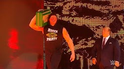 Brock Lesnar celebrates his Money in the Bank win on Raw