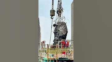 Precision Extraction: Workers Removing 42-Meter Residual Piles