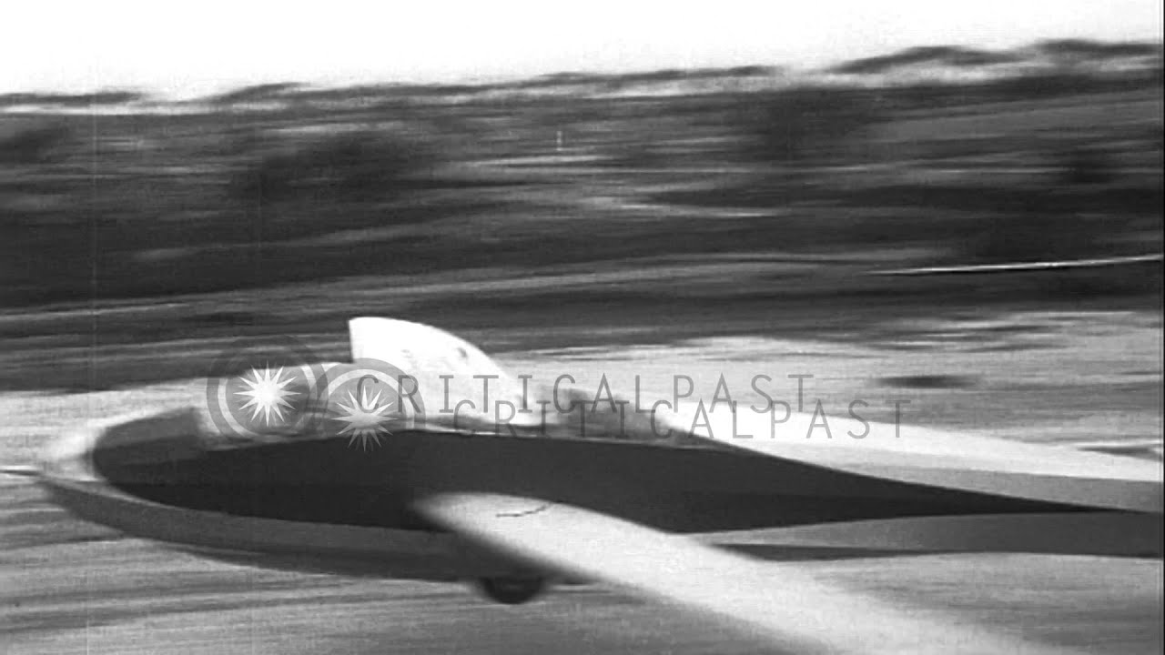 Two gliders attached with a winch take off and in flight during the