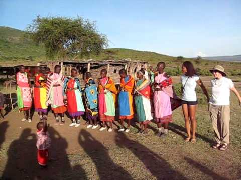 Vanetta and MaryAnne dancing with Masai women