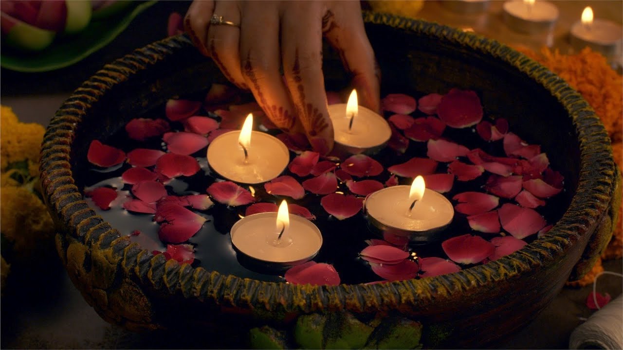 Diwali decoration - woman decorating her house with floating