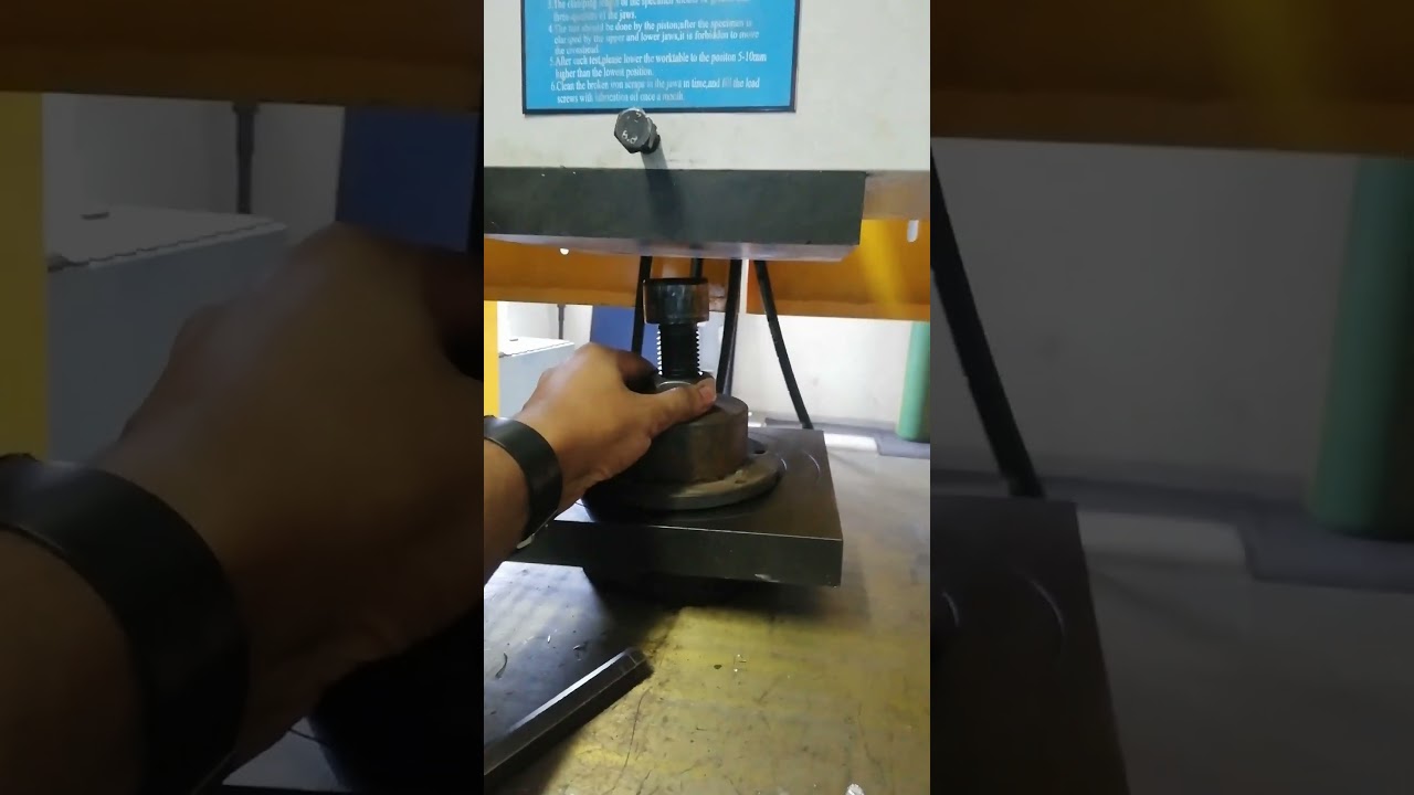 SETTING UP FOR PROOF LOAD TEST ON M36 BOLT ON THE 1000 TONS TENSILE MACHINE