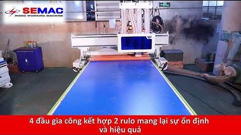 Máy cnc router 4 đầu có rulo đè phôi