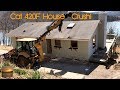 Tearing a house down with Cat 420F with PSM Tilt Coupler