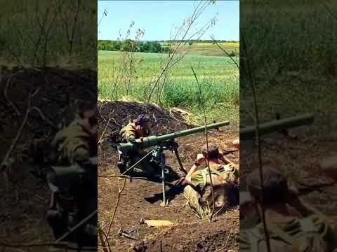 Ukrainian combatants using a SPG-9 'Spear' tripod-mounted 73mm recoilless gun