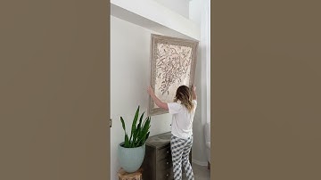Easiest way to hang large art #gifted #diyhack #diyhomedecor #artideas #hangart #diyshorts