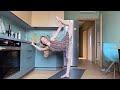 Stretching yoga flow  stretching  in a dress at the kitchen 