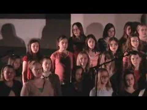 The Norwalk (Iowa) 6th Grade Choir sings three holiday selections: "When I Hear Those Jingle Bells," "Wintertime Aglow," and "Minka."