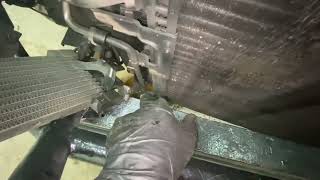 How to remove a radiator from 2002 Dodge Dakota without dropping freon
