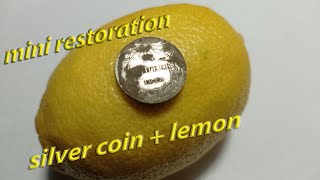 Silver coin and lemon