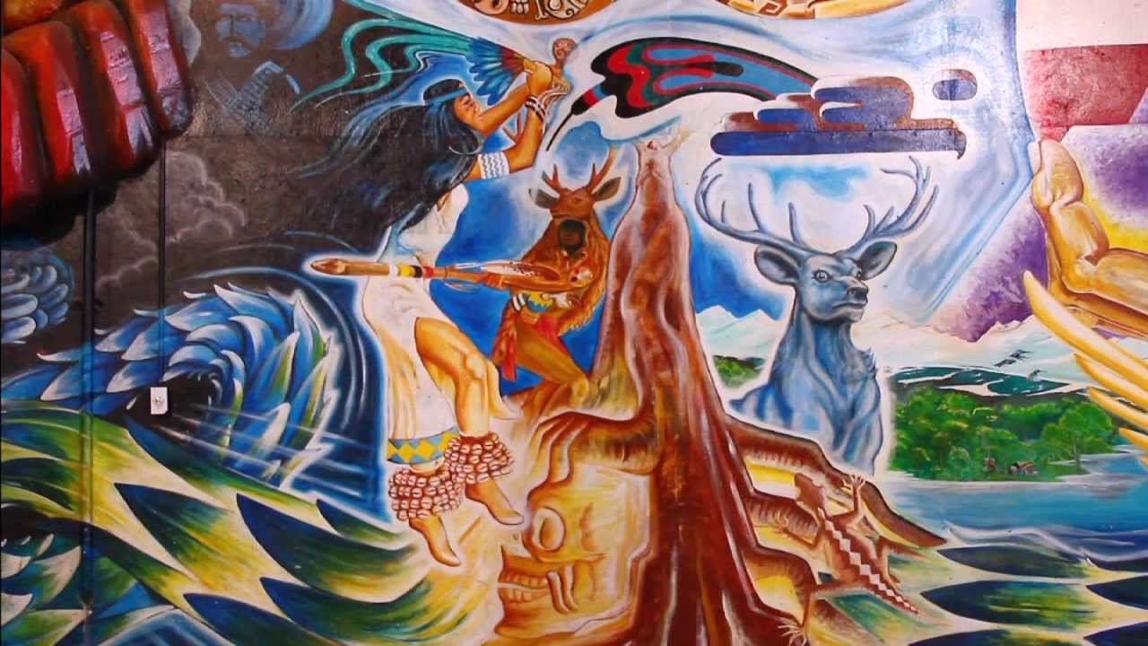 Baker with Isolation Hoop surrounded in artwork