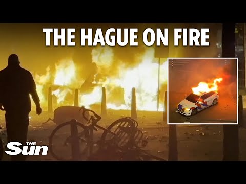 Riots erupt in The Hague with protesters torching cars and clashing with cops