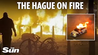 Riots erupt in The Hague with protesters torching cars and clashing with cops