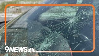 Travelers return to find damaged vehicles after hailstorm pounds Denver airport