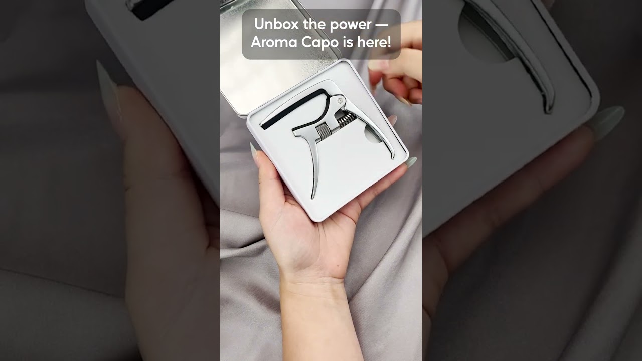 Clunky capo slowing you down? Unbox style & instant key changes with Aroma! 