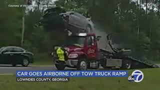 Car flies airborne off back of tow truck in Georgia crash