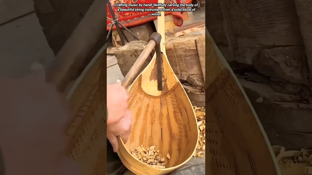 Shaping a beautiful wooden musical instrument by hand.