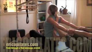 Push through on Pilates Cadillac & Thai massage Stretch - Pilates Chelsea NYC