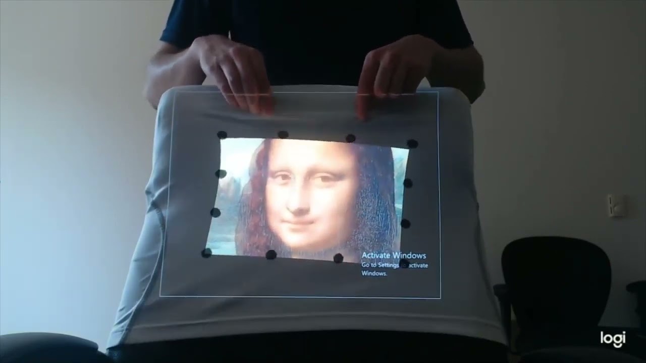 Dynamic projection mapping on deformable stretchable materials using boundary tracking