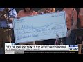 Parkersburg presents $12,500 to Artsbridge at summer concert series kickoff