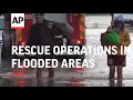 Firefighters continue rescue operations in flooded areas