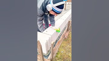 Laying aerated concrete blocks with precision using mortar adhesive for strong wall construction