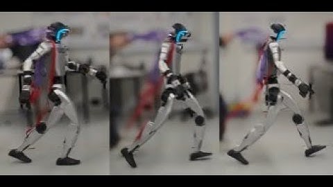Gait-Conditioned Reinforcement Learning with Multi-Phase Curriculum for Humanoid Locomotion