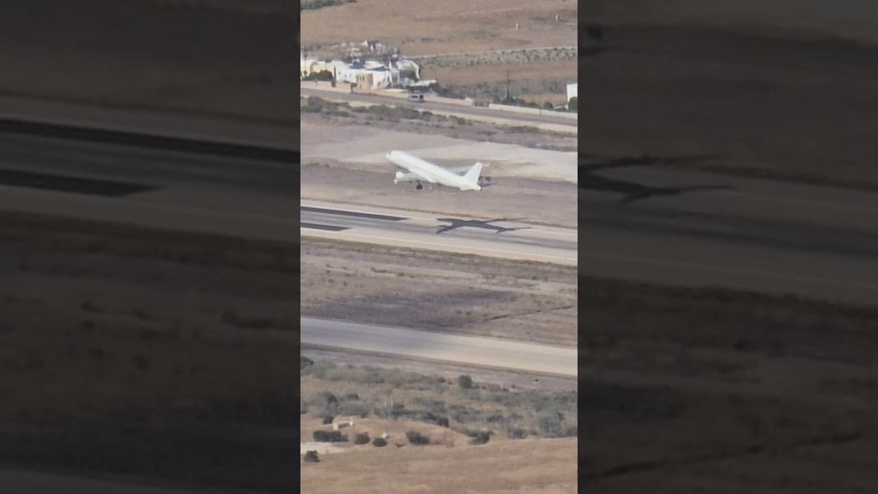 Air Plane take off in Santorini, Greece. 