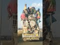 Overloading a bakkie with cargo and passengers in South Africa