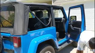 Flipping down the soft top on a 2-door Jeep Wrangler JK (2007-2018) screenshot 5