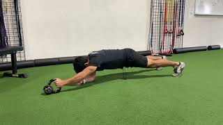 Forearm plank with KB push and pull