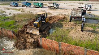 The best new active expert dozer medium push drop rock in water make road with dump trucks team job